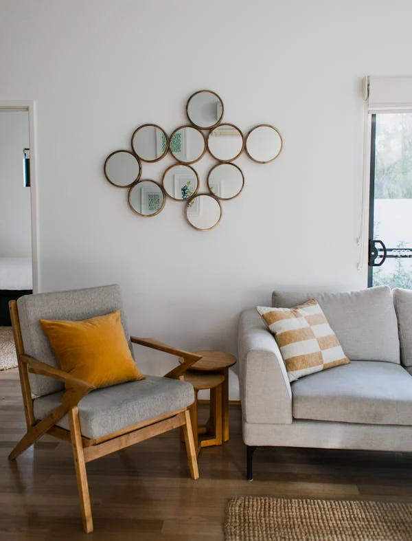 living roomwith gray sofa and white coloured wall that goes with the sofa flawlessly